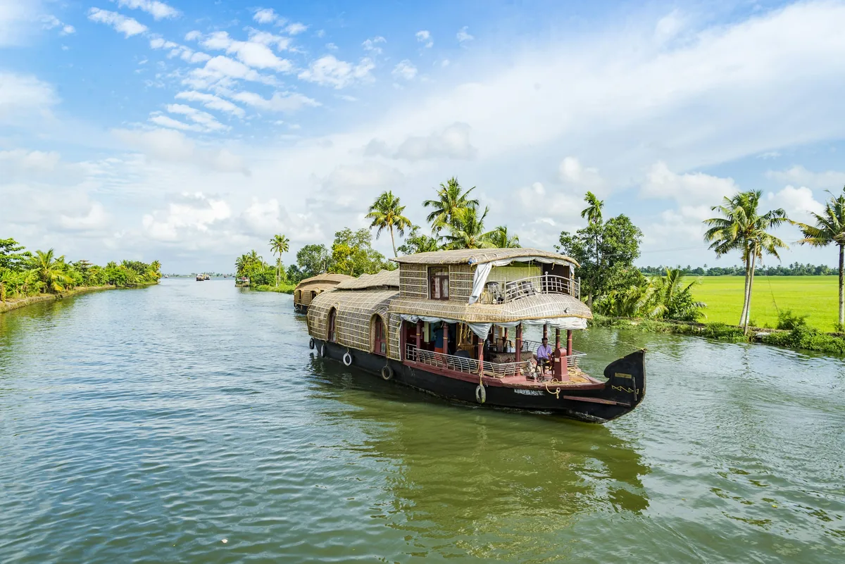 Illustrative houseboat scene on Kerala backwaters